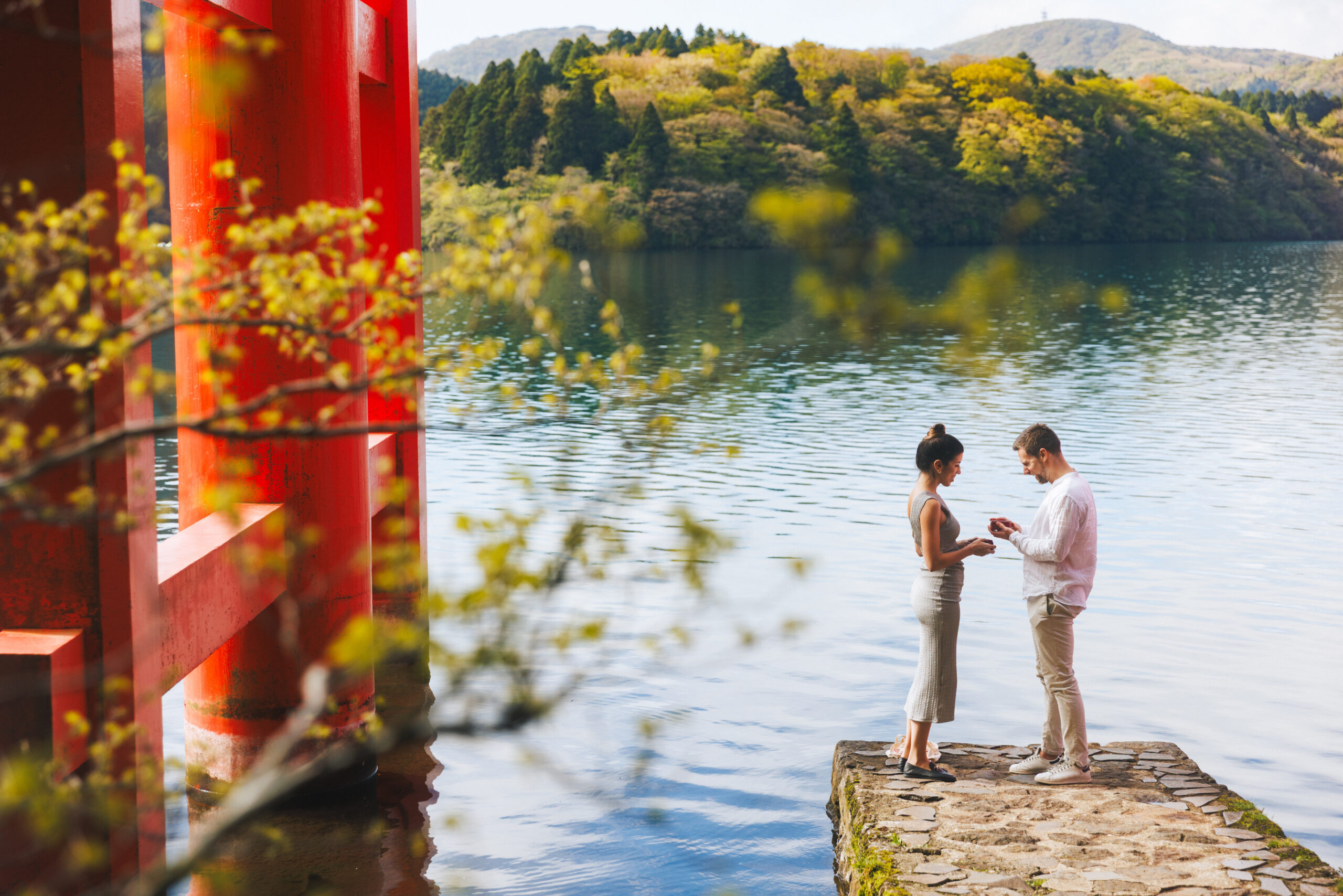 Authentic surprise proposal photography in Hakone with natural expressions, iconic locations, and timeless memories