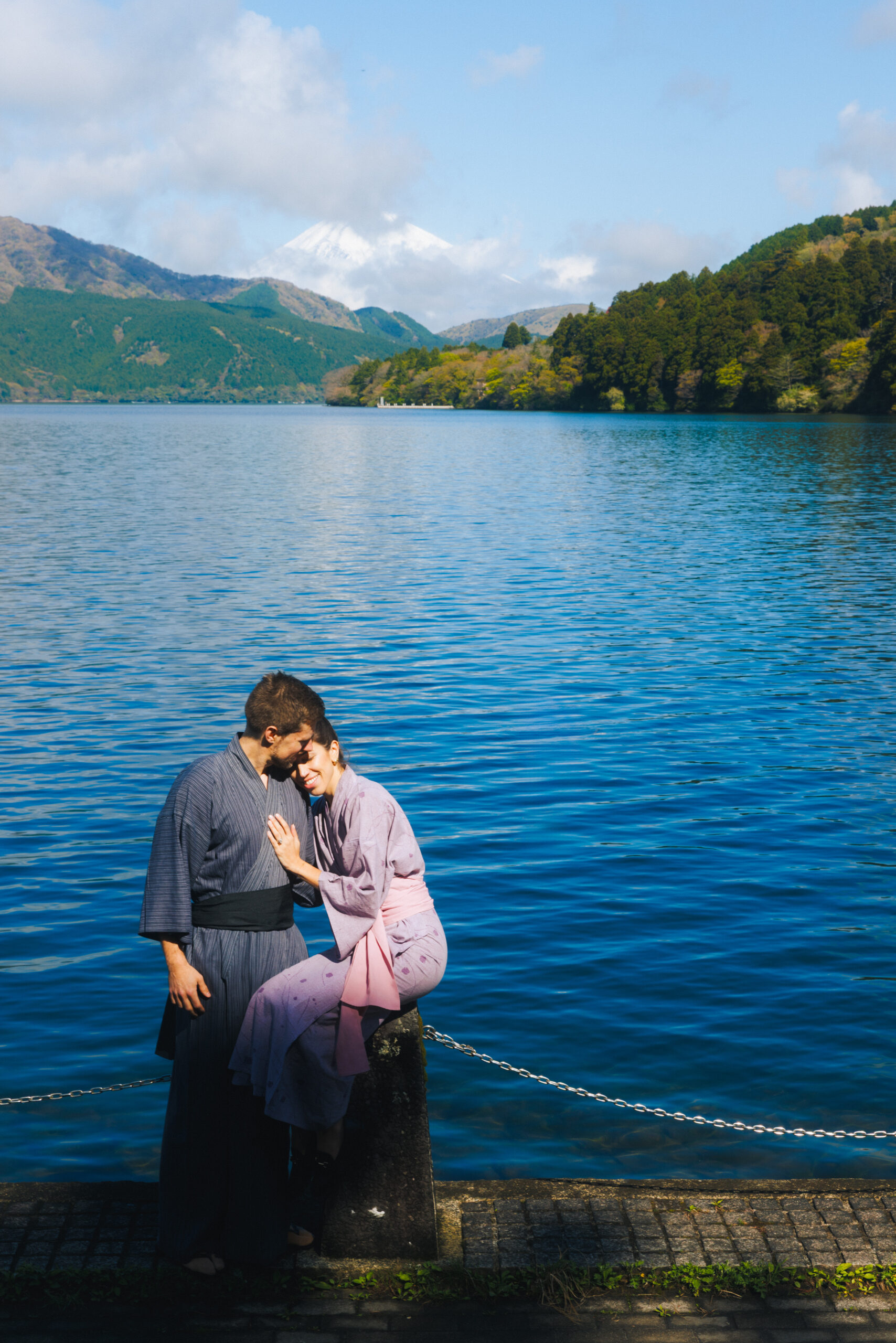 Hakone surprise proposal shoot featuring the iconic Torii gate, scenic lakefront, and intimate candid portraits of the couple
