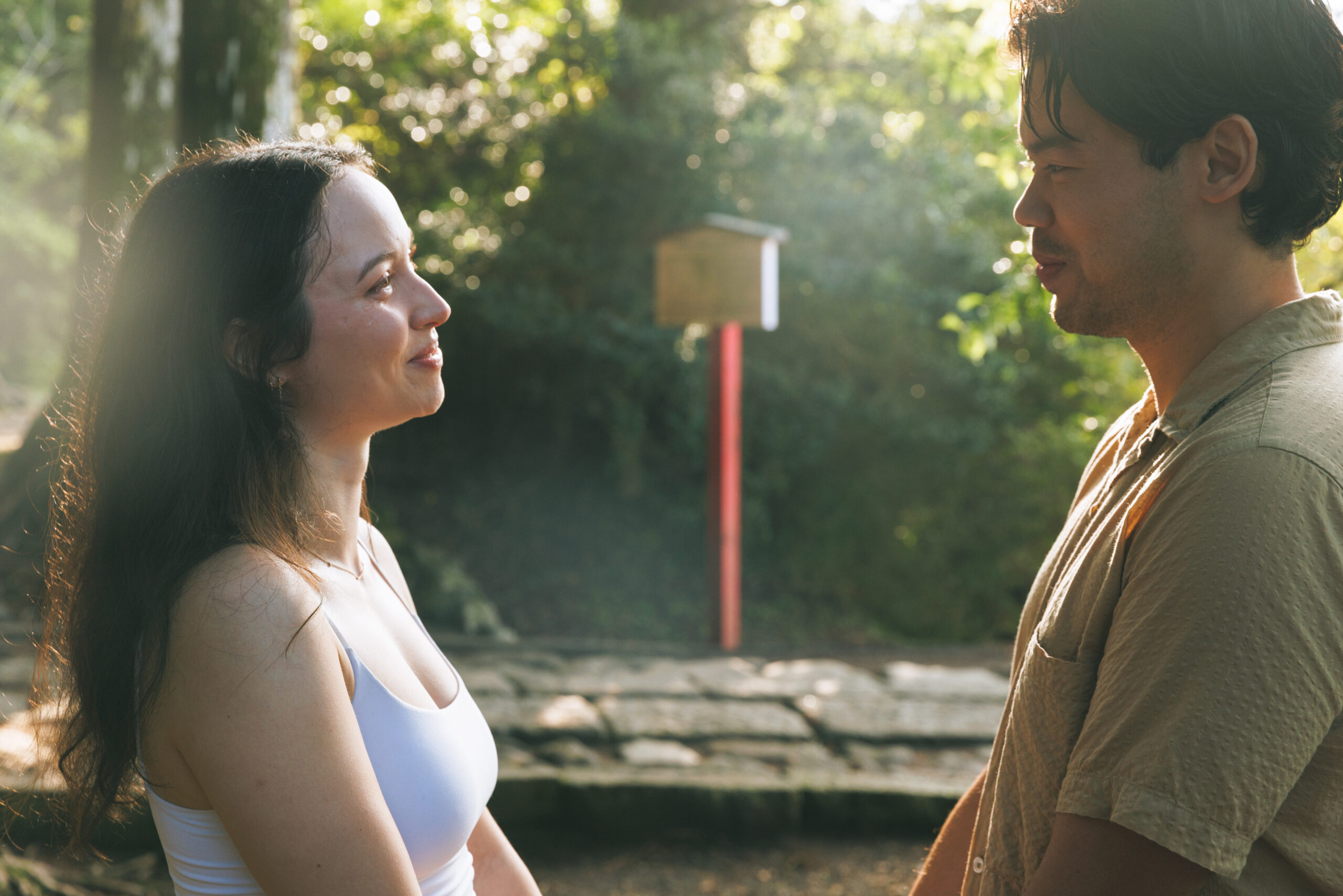 Surprise proposal in Hakone on a clear September morning, with blue skies and autumn light filtering through the trees, capturing emotional tears even without Mt. Fuji.